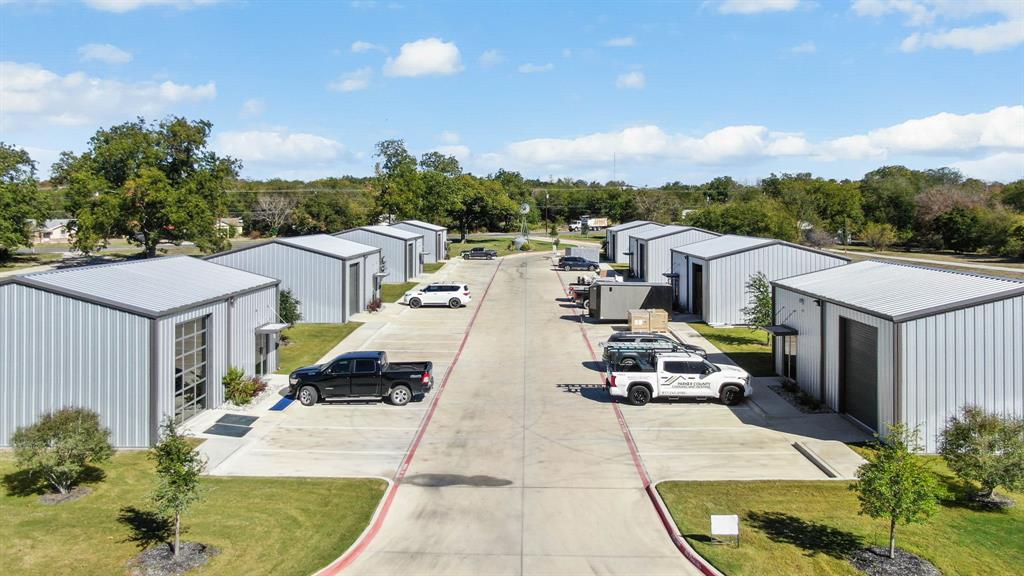 Great investment opportunity! 10 total income producing buildings located just outside the city limits of Weatherford. 100 percent leased with additional land for future expansion. All metal buildings less than 3 years old. 9, 1200 square foot industrial buildings, ALL concrete driveway, 12' roll up doors, and with heat and cooled offices complete with bathrooms. 1 main office 2800 square foot building, and an income producing mobile home. ALL concrete driveway, 12' roll up doors,