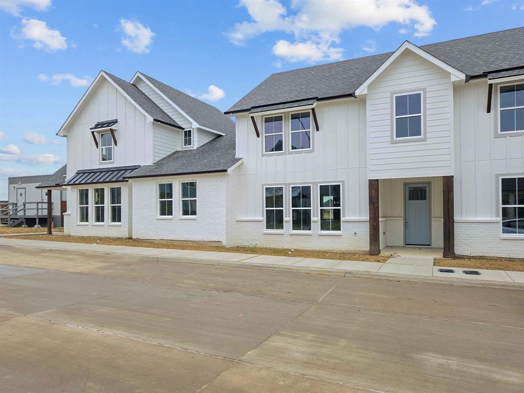 Located in the highly acclaimed Eagle Mountain-Saginaw ISD, this brand-new 2026-built townhome offers modern living in a prime Fort Worth location near shopping, dining, entertainment, and Eagle Mountain Lake. The open-concept floor plan features luxury vinyl plank flooring, a chef-inspired kitchen with stone countertops, stainless steel appliances, and designer finishes throughout. Upstairs, the spacious primary suite includes a spa-like bath with dual sinks, a walk-in shower, and a large walk-in closet. Two additional bedrooms and a full bath complete the second floor. Enjoy peace of mind with a 1-2-10 builder warranty. Don't miss this exceptional opportunity to own a beautiful new home in a growing area!