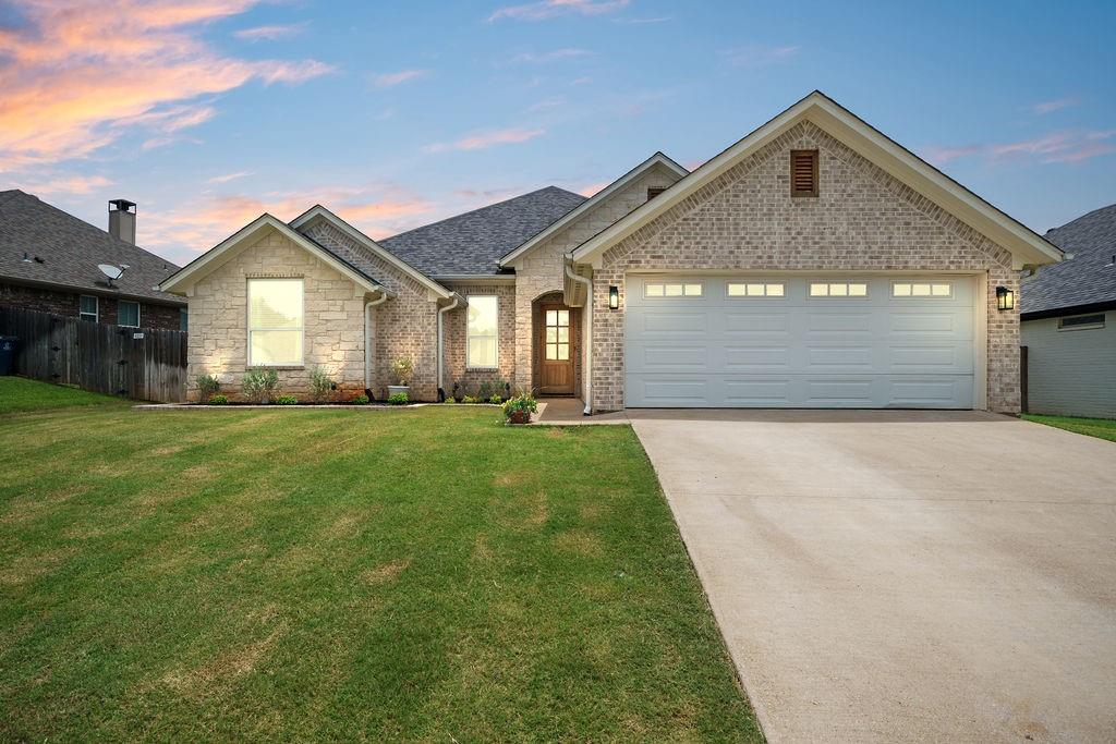 Beautifully maintained home in the highly sought-after West Ridge subdivision and located within the acclaimed Bullard ISD. Offering 1,971 square feet of heated and cooled living space, this 4-bedroom, 2-bath home features a desirable split-bedroom floor plan that provides both comfort and privacy. The spacious interior showcases high-quality wood-look laminate plank flooring throughout the main living areas and primary suite, while the secondary bedrooms feature neutral carpeting. Both bathrooms are finished with elegant tile flooring. Energy-efficient windows allow an abundance of natural light to fill the family room and primary bedroom, creating a warm and inviting atmosphere. The well-appointed kitchen features stainless steel appliances, granite countertops, and a brick-accented island that adds character and charm. Energy-saving features, including foam insulation at the rafters, help maximize efficiency and keep utility costs low. Since purchasing the home, the owners have made several thoughtful improvements, including the installation of French drains and catch basins in the backyard to enhance drainage and help prevent excess water accumulation. A covered concrete patio with a retaining wall creates a versatile outdoor living space perfect for entertaining, relaxing, or enjoying family activities. An exterior storage shed has also been added on a raised wood platform and is complemented by pea gravel landscaping and a concrete stepping-stone walkway. Conveniently located near everything Bullard has to offer, this beautiful home combines quality finishes, energy-efficient features, and valuable upgrades. Don’t miss the opportunity to see this exceptional property in person.