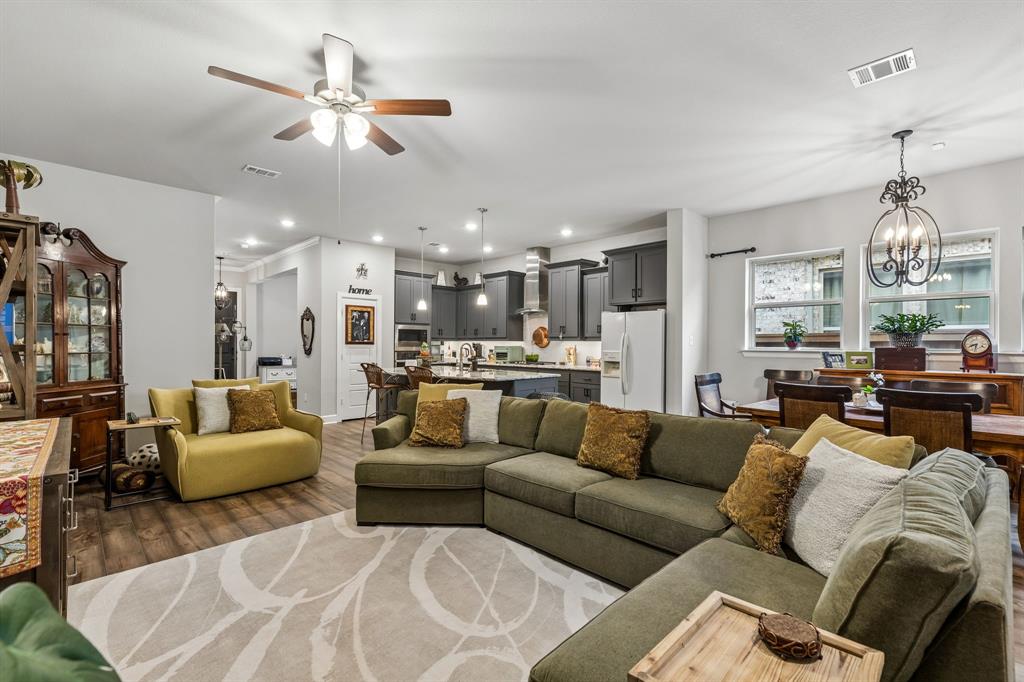 Welcome to effortless living in the highly sought-after Viridian 55+ community in Arlington. This beautifully maintained 2-bedroom, 2-bath home offers the perfect blend of comfort, style, and low-maintenance convenience. Step inside to an inviting open-concept layout featuring a spacious kitchen that flows seamlessly into the living and dining areas—ideal for both everyday living and entertaining. The kitchen is a true centerpiece with abundant cabinetry, a large island, and modern finishes, all overlooking the heart of the home. The private primary suite provides a relaxing retreat with an en-suite bath and generous closet space, while the secondary bedroom offers flexibility for guests. Enjoy peaceful mornings and quiet evenings in the screened-in porch, perfect for year-round enjoyment. Residents enjoy access to resort-style amenities, including a clubhouse, sparkling pool, putting green, and pickleball courts—designed for an active and social lifestyle. With beautiful curb appeal, thoughtful design, and access to premier amenities, this home offers the ideal balance of comfort, community, and convenience.