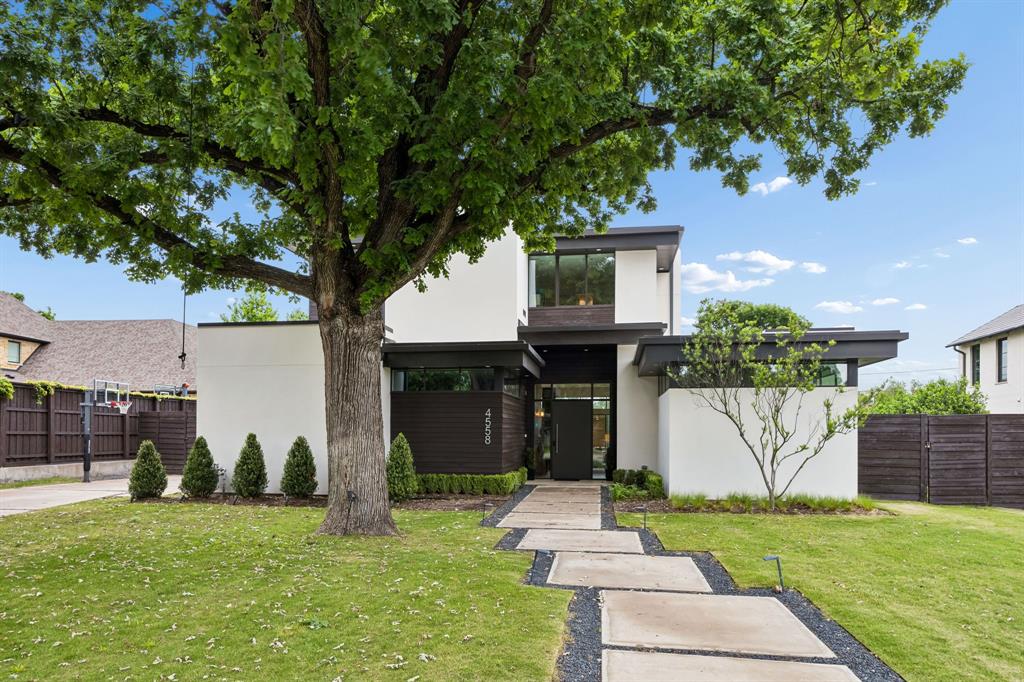 Welcome to modern living done right. This stunning home by award-winning Greico Modern Homes sits right in the heart of the private school corridor and is packed with style, light, and thoughtful design.

From the moment you walk in, you’ll notice the soaring ceilings and walls of glass that flood the space with natural light. The open living, dining, and kitchen area flows effortlessly—perfect for hosting friends or just hanging out at home. The kitchen is sleek, functional, and made for gathering.

The primary suite is a true retreat, featuring a spa-like bathroom, a huge walk-in closet, and even a private gym space—your own personal escape without leaving home. There’s also a flexible first-floor guest room that’s currently set up as an office.

Step outside and it only gets better. The oversized lot gives you tons of options—think pool days, soccer games, adding a sports court, or even building a guest house. The pool cabana is ready for entertaining and weekends well spent.

Tucked on a beautiful horseshoe-shaped street in desirable Walnut Hill Ridge and surrounded by multi-million-dollar homes, this is one of those neighborhoods people don’t want to leave. Plus, there are architectural plans available if you want to expand in the future.