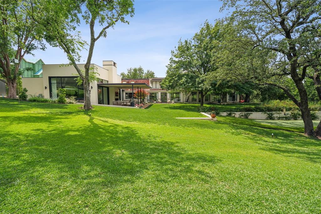 Back on the market with a new price! Experience refined living in this meticulously remodeled residence by Rick Yuill, offering 7,740 sq ft of luxurious space nestled along the scenic Shady Oaks Golf Course. The home showcases breathtaking views and modern updates that seamlessly blend sophistication and comfort. The newly added kitchen and living spaces feature state-of-the-art Wolf appliances, Subzero refrigerators, and an expansive pantry—designed for both functionality and elegance. The primary suite is a private retreat, complete with a cozy sitting area, gas fireplace, and dual his-and-her bathrooms. Entertain effortlessly in the formal living room, featuring two wet bars and house-wide surround sound system. The custom bar area, equipped with refrigerator drawers, a wine fridge, and seating for seven, provides the perfect setting for gatherings. Additional highlights include a small workout space conveniently located off the 2-car garage and a golf cart garage with direct access to the course. This home is a showcase of luxury and thoughtful design, offering every amenity needed for elevated living.