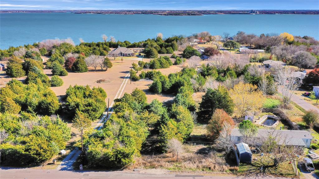 Build your DREAM HOME on this rare 2.5 acre lakefront lot on Lake Lavon. This beautiful lot has a tree line that backs
up to the Corps of Engineer land, giving you even more privacy. If walking out your front door to drop a line in the lake
and then enjoying sunset views from your back porch sound wonderful, this is your chance to build your own slice of
heaven. Water and electricity access at front of the property. You will need a septic. Close enough to town, yet far
enough away to unwind in the country air. Lake Lavon is well-known for hiking, biking, camping, fishing and boating.