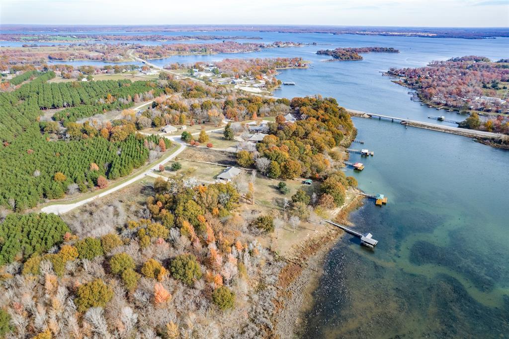 Discover your perfect slice of paradise on this .707-acre lakefront lot in The Haven at Lake Fork, home to the #1 bass fishing lake in Texas. Nestled at the end of a quiet cul-de-sac and backing up to peaceful agricultural land, this property offers the ideal blend of privacy, natural beauty, and endless recreation. The heavily treed landscape provides both shade and seclusion, creating the perfect canvas for your dream home or weekend retreat. With dock approval, you can build your own private access to Lake Fork—step right from your backyard to world-class fishing, boating, and breathtaking sunsets. Whether you envision a cozy home tucked among the trees or a custom lakefront estate, this property delivers limitless potential in one of East Texas’s most sought-after communities. Don’t miss your chance to own a piece of Lake Fork—where tranquility meets adventure!