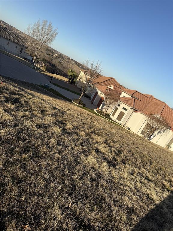 Build your custom home on this residential lot in Eagle Mountain Lake Estate in north Fort Worth. Located on a quiet street, the property offers city water, sewer, and electricity available with paved road access. Enjoy nearby Eagle Mountain Lake, parks, and recreation with convenient access to shopping, dining, and major roads. Situated in Eagle Mountain–Saginaw ISD. Ideal for a primary residence or future investment. Buyer to verify all details.