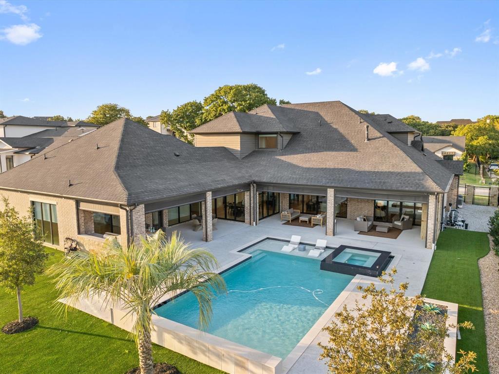 Discover this exquisite modern masterpiece, recently constructed and offering an expansive 5,800 sq. ft. of luxurious living space. Featuring 5 bedrooms, 7 baths, and 2 versatile living areas, this custom-designed home is built for comfort and style. Two generously sized screened-in patios create the perfect setting for entertaining, while the low-maintenance backyard is a dream come true. Relax in the heated Claffey pool and spa, or enjoy the nearly 8,000 sq. ft. of field-green artificial turf, complete with a dedicated pet area. A true haven for relaxation and entertainment, set in an unbeatable location with easy access to the highly sought-after amenities of Westlake, Southlake, Keller, and Roanoke. Just a 20-minute commute to DFW Airport's North entrance. Priced below appraised value—ready for immediate move-in!