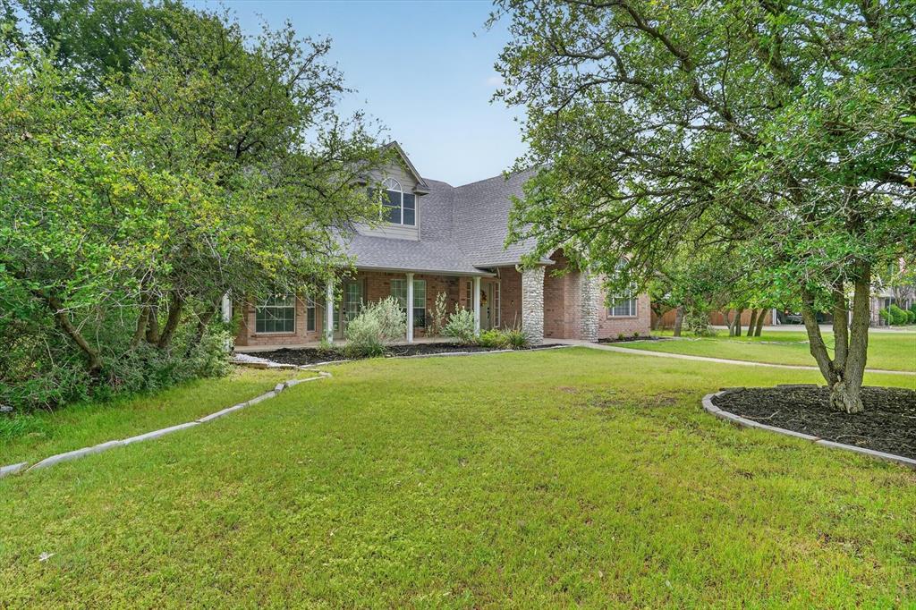 Nestled within the highly sought-after Aledo ISD, this beautifully updated two-story home offers space, charm, and incredible potential. Featuring 4 spacious bedrooms, including an oversized primary suite, this home is designed for comfortable living with room to grow.
The kitchen shines with stunning quartz countertops, providing a modern touch and plenty of space for cooking and gathering. Natural light flows throughout the home, while the treed lot offers privacy and a peaceful setting. New water softener is an added bonus.

A standout feature is the oversized 3-car garage with a bonus room above—complete with its own bathroom—perfect for a guest suite, office, or studio. With a little TLC, this space could truly shine.

Enjoy outdoor living year-round with covered porches wrapping the front, side, and back of the home—ideal for relaxing or entertaining.

This property combines desirable updates with unique features and endless possibilities in a prime location.