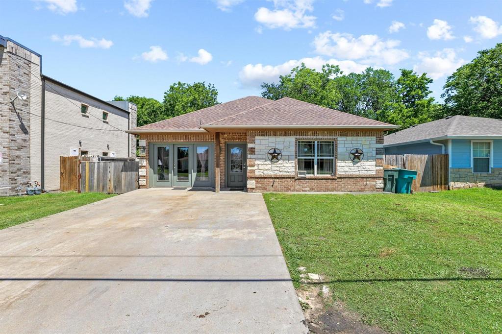 Move-in ready and ideally located near the heart of downtown Sherman, this charming brick home offers the perfect blend of comfort, style, and convenience. Just minutes from vibrant downtown shopping, dining, entertainment, and within close proximity to Austin College, this charming home features a thoughtfully designed floor plan with two spacious living areas, providing flexibility for relaxing, entertaining, or a home office setup.  It has been freshly painted and ready for new owners.  The main living area showcases a recessed ceiling, beautiful crown molding, and an open-concept layout that creates an inviting atmosphere throughout the home. The kitchen is both functional and stylish with marble countertops, ample cabinetry, and a separate movable island that adds versatility to the space.  With its well-designed layout, modern finishes, and unbeatable location near all that downtown Sherman has to offer, this two-bedroom, one-bathroom home is an excellent opportunity for first-time buyers, investors, or those looking to be close to Austin College and the growing downtown area.