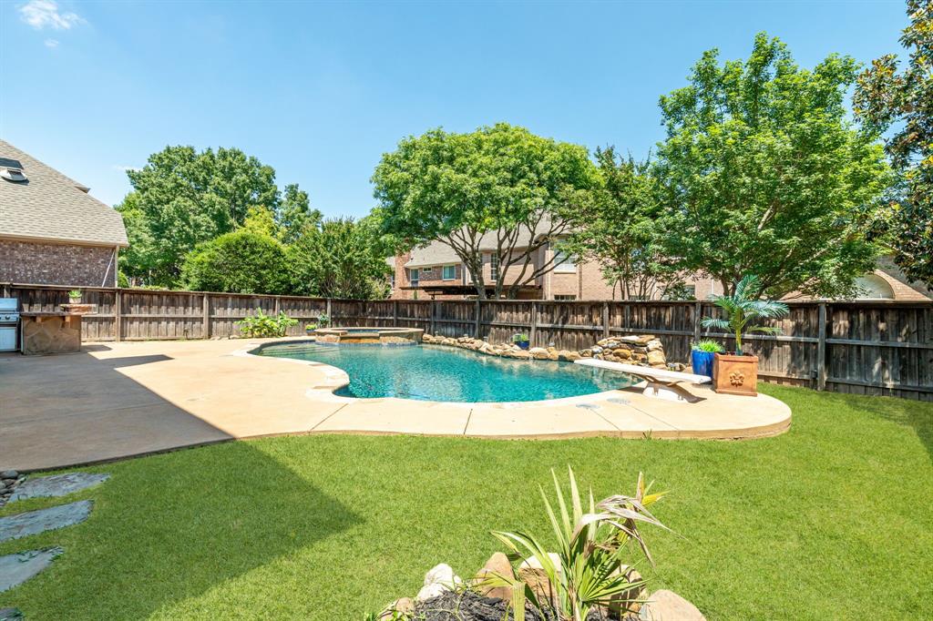 Welcome home to this stunning 4 bedroom, 4 bathroom home in the Spring Hill neighborhood within McKinney’s acclaimed Stonebridge Ranch community. Offering 3,567 square feet of beautifully designed living space, a sparkling pool and spa, and a seamless blend of elegance and comfort, this home has it all. From the moment you enter through the decorative steel front door, you are greeted by stacked formals providing flexible living and entertaining space. The open floor plan flows into the main living area featuring a fireplace, rich wood flooring, crown molding, and a wall of windows that fills the home with natural light. The living room opens to the breakfast area and chef inspired kitchen complete with a large center island, ample cabinetry, gas cooktop, and wine fridge. The main level also includes a private guest bedroom and full bath, ideal for visitors or a home office. Upstairs, a spacious game room offers the perfect secondary living space. Two additional bedrooms are connected by a Jack and Jill bath, each with its own sink and walk in closet. One upstairs bedroom also features a walk out attic for added storage. The step down primary retreat is a true sanctuary with a double sided fireplace opening to a flexible bonus space perfect for a workout area, office, reading nook, or dressing room. The luxurious primary bath offers two large walk in closets. A 3 car garage provides generous storage and parking. Step outside to your private backyard oasis featuring a pool and spa with a waterfall, diving board, and built in outdoor kitchen perfect for entertaining. Additional highlights include an abundance of closets and storage, fresh paint, updated carpet in the game room and downstairs bedroom, downstairs HVAC replaced in 2025, and two hot water heaters updated in 2021.