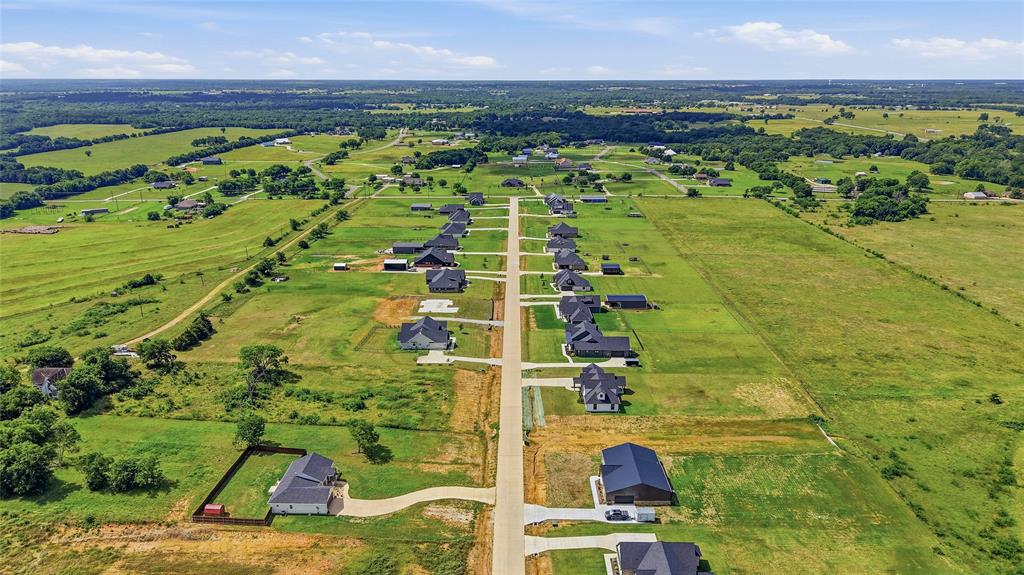 Rare opportunity to take over and complete a custom home in the desirable Dixie Estates community in Whitesboro, TX. Situated on a spacious acreage lot surrounded by beautiful custom homes, this property already has the groundwork in place for an impressive 4 bedroom, 3.5 bathroom home with 2 living areas and a thoughtfully designed floorplan. The slab has been poured and building plans are available, giving buyers, investors, or builders the chance to pick up where construction stopped and bring their own vision to life. The proposed layout features an open concept design with a spacious great room, large kitchen with island, split-bedroom arrangement, dedicated dining area, bonus living space upstairs, and a covered back porch overlooking the oversized backyard. The primary suite was designed with a large walk-in closet, soaking tub, walk-in shower, and private retreat feel. Secondary bedrooms are generously sized, making this floorplan ideal for families, entertaining, or multigenerational living. This property offers the flexibility to customize finishes, materials, and design selections to match your style without starting from scratch. Whether you’re an investor looking for your next project, a builder wanting to complete a spec home, or a buyer searching for a chance to create your dream home in a growing area, this is an opportunity with tremendous upside. The current builder will not be completing construction, and the property is being sold as-is with buyers responsible for completing the project. Utilities, restrictions, and build requirements should be independently verified by buyers. Conveniently located near Whitesboro with easy access to Sherman, Gainesville, and Lake Texoma while still offering the peaceful country atmosphere that makes Dixie Estates so desirable.