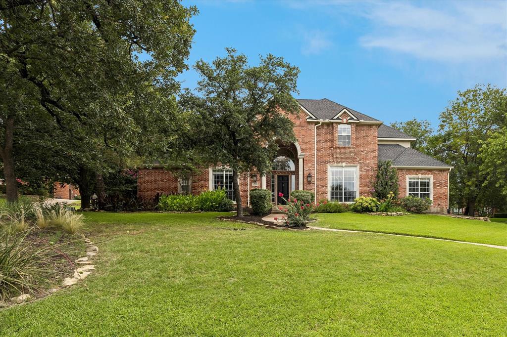 Welcome to this beautifully updated home in the heart of Trophy Club, where timeless design, quality upgrades, and an unbeatable location create an exceptional lifestyle. A stunning Restoration Hardware chandelier welcomes you into a thoughtfully designed floor plan featuring elegant finishes throughout. The chef's kitchen is ideal for entertaining with a marble center island, built-in wine refrigerator, built-in drink fridge and instant hot water dispenser perfect for tea, coffee, and meal prep. The open living spaces extend seamlessly to a private backyard retreat featuring newly installed turf, a tranquil water feature with a new pond pump (2026), and a covered outdoor living area complete with a built-in grill, beverage refrigerator, and gas fireplace—perfect for year-round entertaining. The luxurious primary suite showcases new hardwood flooring (2024) and a fully renovated spa-inspired bath. The laundry room has also been completely renovated, while the downstairs guest bedroom features new carpet (2024). Enjoy peace of mind with major system updates including a new 4.5-ton HVAC system (2026), upstairs HVAC replaced in November 2023, Rinnai tankless water heater, insulated garage door, and brand-new garage door opener with MyQ smart technology. Located in the highly acclaimed Trophy Club school district, this home is zoned to Lakeview Elementary, Medlin Middle School, and Byron Nelson High School. Enjoy an incredible walkable lifestyle just .4 miles from Anamia's Tex Mex, Jersey Mike's, Chipotle, Thai Taste, Social Oak Wine & Whiskey Lounge, Starwood Café, Pour Sports, Wingstop, and Rosati's Pizza. Local favorites including Hutchins BBQ, HG Sply Co., and Leila's Wine Bar are only a two-minute drive away. Ideally situated in the Westlake financial corridor with convenient access to Charles Schwab, Fidelity Investments, DFW Airport, shopping, dining, and major highways. Show and sell!