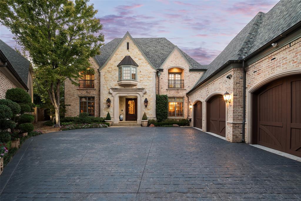 Situated on nearly half an acre in one of Glen Abbey’s most desirable locations, this exquisite Hawkins Welwood-built home has been elevated in recent years under the design direction of Lori Golman to offer a truly updated, custom experience. Against the backdrop of the championship tee box of the 3rd hole at Bent Tree Country Club, enjoy the vast backyard with a pool and spa, cozy fire pit, and covered outdoor patio equipped with heaters and speakers—all perfect for entertaining. A spacious courtyard with water feature, pergola and fans provides another shady option for al fresco dining. Inside, revel in 11-foot ceilings and a gourmet kitchen boasting a Wolf cooktop, Thermador double ovens, and a Subzero fridge and beverage drawers. The luxurious master suite includes his and her baths and closets and a luxe chromatherapy shower. Lavish media room is outfitted with soundproof walls, wet bar and lighted cabinetry and designer accent lighting. The stately private study offers ample room for additional seating and two hidden closets for storage. The fourth bedroom suite conveniently doubles as a living area and pool bath, and an adjacent sunny gardening room enhances the home's allure. Oversized utility room provides a second work-from-home area, with built-in work station overlooking the courtyard. Top-tier updates include wall coverings by Phillip Jeffries, lighting by Visual Comfort and Ralph Lauren, and custom chandeliers by Paul Ferante in the breakfast room and kitchen island. Beyond the beautiful aesthetics, buyers will appreciate the recently replaced Lennox high-SEER HVAC systems, a whole house generator, and the spacious outdoor storage closet and walk-in attic storage. The prestigious Glen Abbey community, known for its serene ambiance and guard-gated security, makes this move-in ready property the epitome of executive living at its finest!