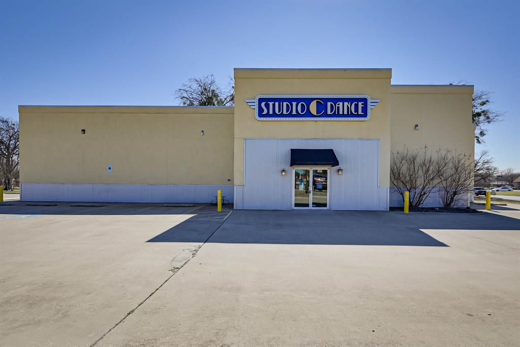 Over 3,900 SQFT on .75 acres. Commercial Space Zoned GR General Retail District On High Traffic Road Frontage of NW Newton visible from Wilshire in Burleson right off Main HWY 174. 
This is a One owner building that has been meticulously kept with GREAT Parking, extra Green space behind building and parking lot that could be utilized. 

Interior layout consists of 2 large studios, Office, bathroom, 3 Air conditioning systems.  Very High Ceilings and quite a bit of storage through storage closets and decked attic space.

Flooring is a “Sprung Floor” with a Marley dance surface which is a professional dance studio build out.