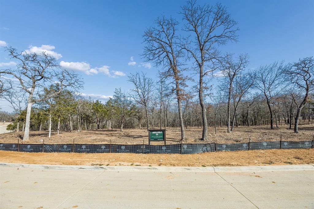 Discover an extraordinary opportunity to build your dream estate on one of Southlake's most coveted homesites. This exceptional cul-de-sac lot offers the perfect canvas for discerning buyers seeking ultimate luxury living within award-winning Carroll ISD. Spanning on a generous 1.41 acres, this premium homesite boasts breathtaking proximity to Lake Grapevine with mature trees and a tranquil natural setting.

Designated for construction by Willow Tree Custom Homes, renowned for meticulous craftsmanship and sophisticated architectural excellence. Their expertise ensures your custom luxury estate will be built to the highest standards of quality and design. Nestled within a distinguished estate community, The Conservation offers the perfect balance of seclusion and accessibility. 

Zoned to Carroll ISD, consistently ranked among Texas's premier school districts with nationally recognized academic and athletic programs. Minutes from Southlake Town Square's upscale amenities, DFW Airport, and major corridors. Lake Grapevine's boating, fishing, and trails are virtually at your doorstep. This is a rare opportunity to secure one of Southlake's finest remaining estate lots.