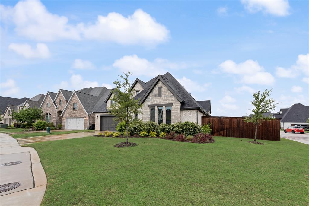 Welcome to 2442 Sibley Drive located in the highly sought after gated community of Lakes of Somercrest in Midlothian Texas. This beautiful home features four bedrooms three full bathrooms one half bathroom and a rare three car garage. Situated on a premium corner lot the property offers exceptional privacy along with direct access to the communitys large pond. Inside you will find a spacious open concept layout with a private office boasting elegant vaulted ceilings perfect for work or study. The primary suite is tucked away for maximum privacy and includes a luxurious bathroom while the additional bedrooms are generously sized and well appointed. Enjoy the thoughtfully designed living spaces that flow effortlessly for both everyday living and entertaining. Residents of this gated community enjoy access to the scenic pond parks and trails in a family friendly neighborhood served by excellent Midlothian ISD schools. This move in ready home is an outstanding opportunity in one of Midlothians most desirable locations.