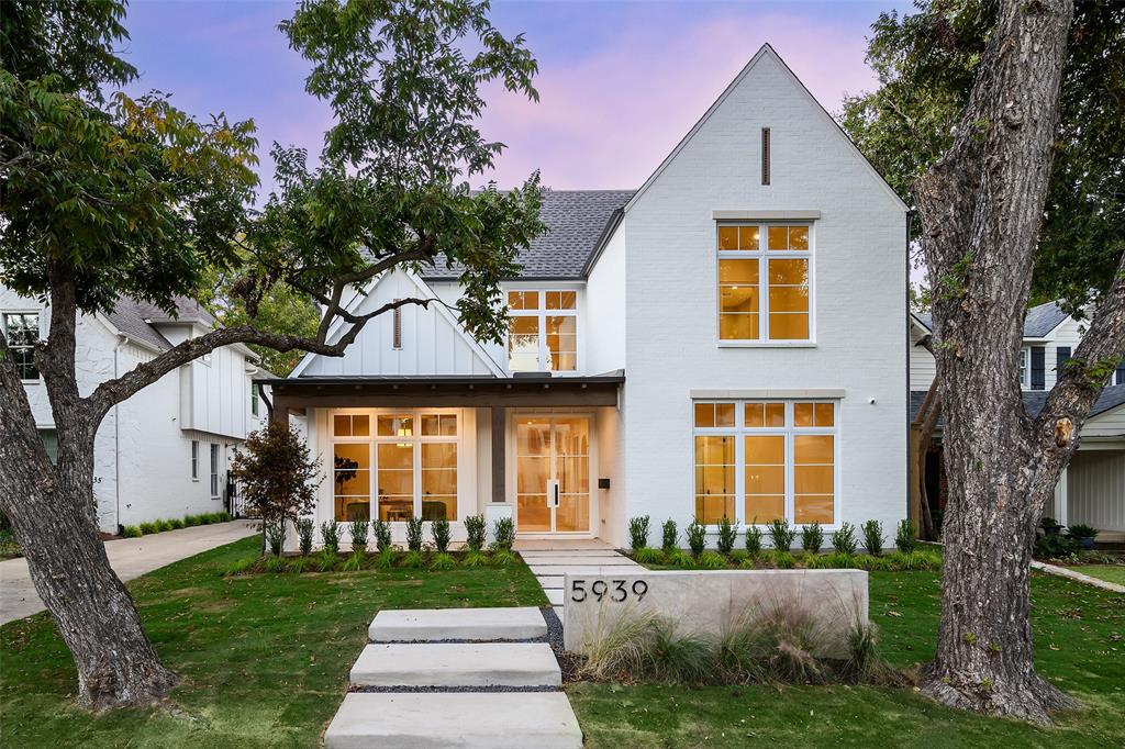 Set along one of East Dallas’s premier streets, this Tanner Homes build reflects thoughtful design and craftsmanship in every detail. The exterior makes a statement with a steel front door and metal roof accents that frame the façade with modern character. Inside, white oak floors and natural light move through the home with ease. At the front, the dedicated office with a coffered ceiling is perfectly placed for focus and privacy. Nearby, a guest suite on the main floor offers comfort and convenience for visitors or extended stays. The living room opens wide, wrapped in windows that bring in the light while a fireplace anchors the space. The kitchen is stunning with Thermador appliances, quartz countertops, a large island for gathering, custom cabinetry, and a butler’s pantry with a wine fridge tucked just out of view. Upstairs begins with a loft that connects the upper floor. The nearby game room adds flexibility and room to unwind or entertain. The primary suite feels calm and elevated, with a vaulted wood-beamed ceiling and a chandelier that adds just the right amount of character. The ensuite bath is finished in marble and includes a soaking tub, walk-in shower, dual vanities, and a custom closet that maximizes both style and storage. Two additional guest bedrooms complete the upstairs, each with a comfortable sense of space and light. The home includes pre-wired speakers throughout, offering integrated sound in every room. Out back, a covered patio with a built-in grill extends the living area outdoors, leading to a spacious grassy yard ideal for gatherings or quiet evenings. With spray foam insulation, a tankless water heater, and high-end finishes throughout, this home stands apart for its quality and craftsmanship. This is the new standard for East Dallas living!