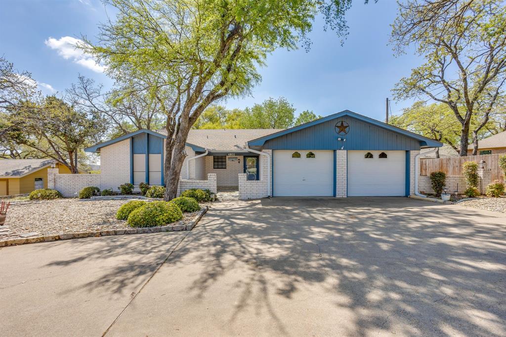 GOLF COURSE LOT located in DeCordova Bend Estates on the 18th hole and steps away from the club house. Property is Move-In ready but could use a little updating. Price has just been dropped again to reflect this. GREAT LOCATION & LOT. Features: Covered back porch, gutters, circular driveway. Living Room is large and open to the dining area and kitchen. Windows across the back of the home faces the golf course and provide great light throughout. Fireplace in LR with built-in shelves. Kitchen has huge amount of counter space and a built-in China cabinet, beautiful counters and many cabinets. Great area for entertaining. Separate Utility Room. Primary bedroom is very large with 2 walk-in closets and is split from other two bedrooms. Garage has 3 doors with two doors facing the front and the golf cart area facing the side. Front Porch has a courtyard area.  
There is a $10,000 buy-in & transfer fees to the club that is to be paid by the buyer. No Survey. Buyers will need to pay for a Survey if one is required.