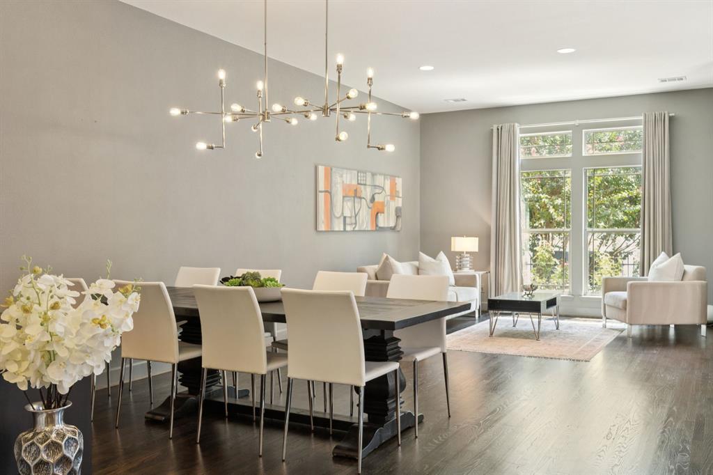 Step into modern luxury in Oak Lawn with this stunning Perry Home that perfectly blends style and convenience, all just minutes from the Katy Trail, American Airlines Center, Uptown nightlife, top hospitals, and easy highway access. Soaring high ceilings and floor-to-ceiling windows flood the open floor plan with natural light, highlighting the rich dark hardwood floors, designer paint, and elegant arch transitions throughout. The chef’s kitchen is equipped with Ken Moore cabinets, timeless granite countertops, a dramatic oversized island, and stainless steel appliances—ideal for entertaining. A beautiful hardwood staircase leads to spacious living areas, while the garage impresses with epoxy floors. Outside is a private patio oasis! A wired security system and gated yard add a sense of privacy. This walkable yet tucked-away community in one of Dallas' most loved neighborhoods offers the perfect blend of excitement and tranquility—come see why this home is the ultimate Dallas lifestyle upgrade!