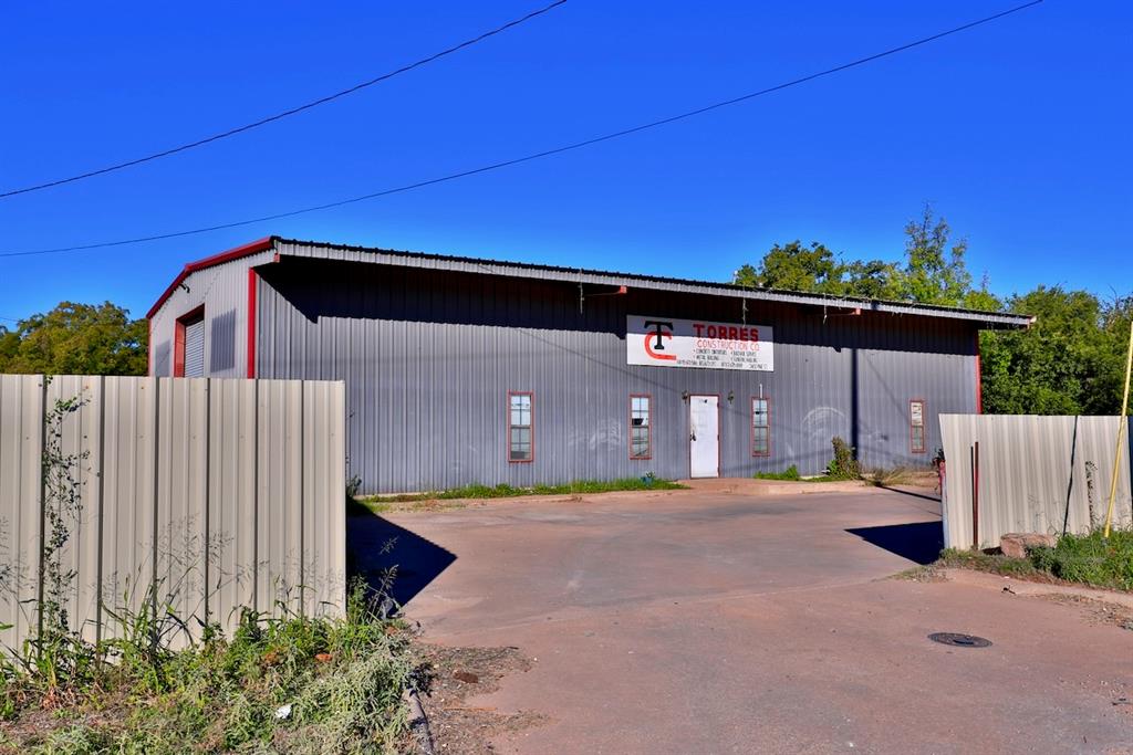 Excellent opportunity for a new or growing business! This property features a large garage shop attached to the main office, providing ample space for equipment, vehicles, or inventory. The main office building includes four private offices and three bathrooms, offering functionality and comfort for daily operations. Outside, you’ll find a detached carport-pavilion and a fully fenced lot with gated entry, ideal for security and convenience. Previously used as a construction business, this versatile property is ready to accommodate a wide range of commercial uses ideal for contractors, service companies, or light industrial use.