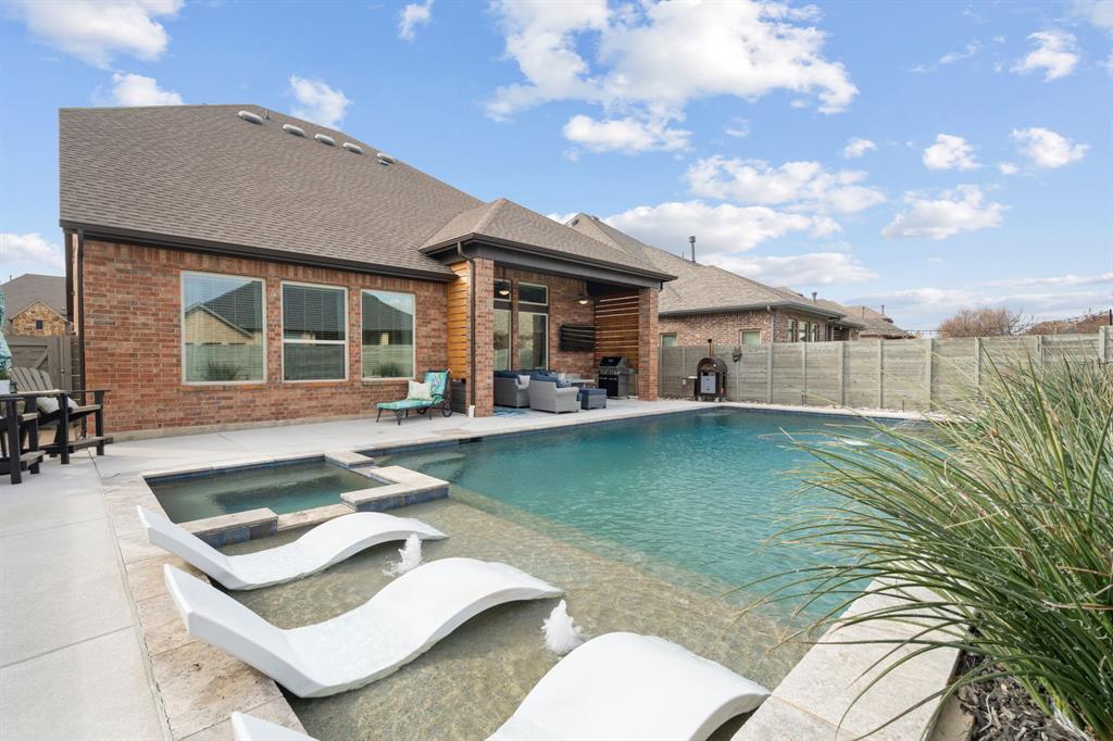 **Motivated Sellers* Experience resort style living in this stunning 4 bedroom, 4 full bath David Weekley home, meticulously maintained and thoughtfully upgraded for comfort, style, and effortless entertaining.

The first floor offers a beautifully flowing layout with a dedicated home office featuring custom built ins, formal dining, and a true chef’s kitchen equipped with premium Viking appliances (refrigerator conveys). Stylish custom barn doors lead to the pantry, and additional under-stair storage adds everyday convenience. The spacious laundry room includes custom cabinetry and stacked LG ThinQ washer and dryer. Tucked down a private hallway, a secondary bedroom and full bath provide the perfect space for guests, while the serene primary suite offers a peaceful retreat complete with a custom closet you have to see to believe.

Upstairs features oversized bedrooms each with private baths, a large open loft ideal for a game room or playroom, an expanded workshop space, and additional walk-in attic storage.

The backyard is the true showstopper—featuring a breathtaking saltwater pool with tanning ledge and spa, an expanded covered patio perfect for entertaining, and low-maintenance pet-ready turf creating a private oasis right at home.