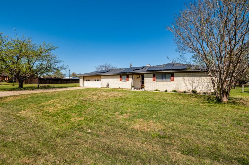 Nestled in the heart of Waxahachie, TX, this beautifully maintained 3-bedroom, 2-bathroom residence offers an exceptional blend of modern comfort and eco-friendly living. With a spacious layout, premium features, and a large lot, this home is perfect for those seeking both style and sustainability.

Upon entering, you'll immediately appreciate the open floor plan that seamlessly connects the living, dining, and kitchen areas, creating a bright and inviting atmosphere. The living room is graced with a classic wood-burning fireplace, perfect for cozy evenings and an ideal focal point for entertaining.

The remodeled primary bathroom is a true retreat, featuring contemporary finishes and thoughtful design elements that promise relaxation. The bedroom offers ample space and plenty of natural light, enhancing the serene ambiance throughout the home.

Beyond the interior, the property boasts a large lot that provides endless possibilities for gardening and enjoying quiet time. One of the standout features of this home is the fully paid-off solar panels, which not only reduce utility costs but also underscore a commitment to sustainable living.

Seize the opportunity to own a piece of Waxahachie that perfectly balances comfort and country living! This property is an ideal choice for those looking to enjoy a peaceful retreat.