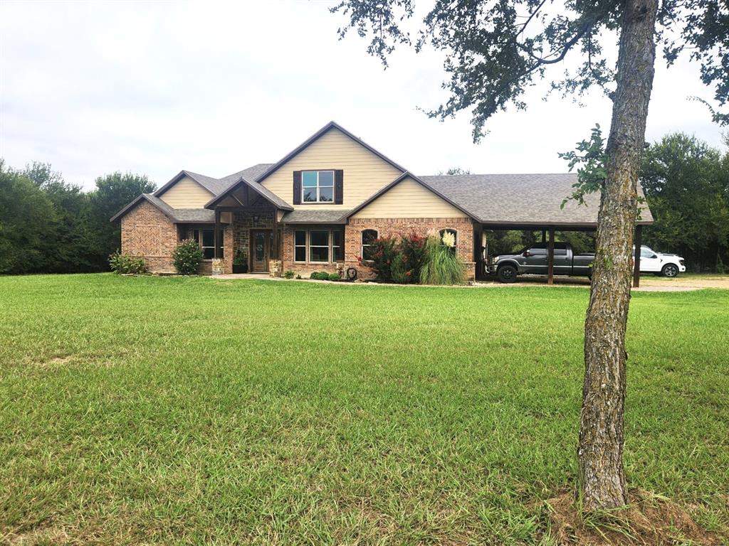 Amazing opportunity to own a beautiful custom home on 11 acres. Very secluded & private. Fully fenced with awesome horse barn (50x60) with 5 stalls,30x50 shop with apt & brand new shop (40x30) with carport. Shops are well insulated with elec & water. Home is energy efficient with foam insulation throughout. Awesome floor plan with lovely wood flooring. Master BR & 2nd BR with full bath down. Master BR features French doors to back patio, trey ceiling, fp, walk-in closet, garden tub, lg tile shower, sep vanities. Formal dining & custom study. Kitchen, with granite, tons of cabinets, walk-in pantry & beautiful tile floor, opens to spacious LA with fp & wall of windows overlooking lg, cov patio & sparkling pool.3rd BR with full bath & game room up. Addl room off the game room could be 4th BR. 10’ dbl mahogany entry door, decked attic space. Owner is installing new Liftmaster electronic gate at the entrance. New roof, new pool equipment, new tankless water heater. 10 acres is currently ag exempt. No restrictions. Addl 11.88 acres available.