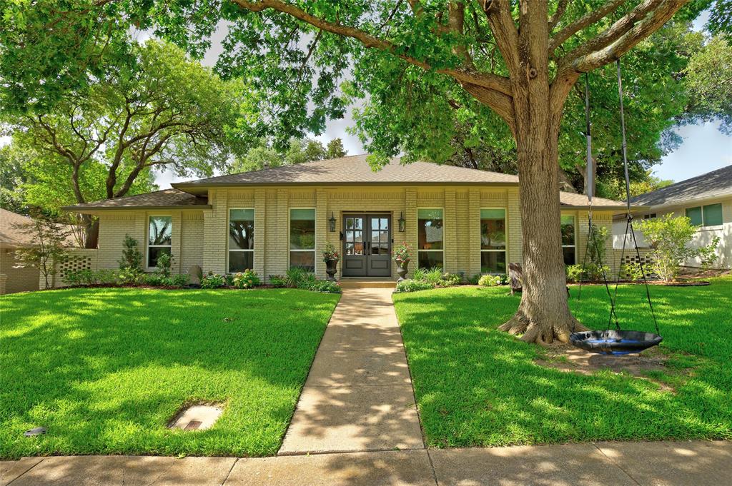 Thoughtfully taken down to the studs and re-imagined in 2019 under the direction of an interior designer, this exceptional Lake Highlands one-story blends timeless design with everyday comfort.  Filled with natural light and nestled beneath mature trees on a quiet street, the home offers spacious living areas that flow seamlessly into a chef’s kitchen featuring custom cabinetry, quartz countertops, a 48-inch Thermador professional gas range with double ovens. Party goers will appreciate the custom beverage bar with an ice maker, beverage refrigerator and additional pantry storage.  The oversized family room is the heart of the home, while the split fourth bedroom with an adjacent full bath offers flexibility for guests, a home office or multi-generational living.  The private primary suite was thoughtfully designed as a peaceful retreat with a spa-inspired bath, expansive walk-in closet, blackout blinds, and soundproofing for an exceptional sleep environment.  Enjoy outdoor living year-round on the covered patio and pergola, with electronic exterior privacy shades at both the front and back entrances for added comfort and convenience.  A two-car garage plus a two-car carport provide abundant parking.  Ideally located in the heart of Lake Highlands and zoned to Richardson ISD, this beautifully renovated home offers quality craftsmanship, thoughtful design, and the warm, welcoming feel that make a house truly feel like a home.