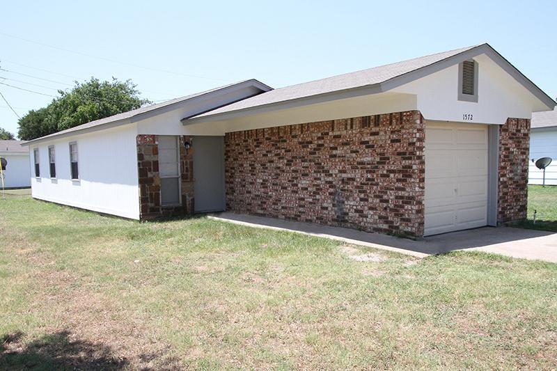Add this super cute three bedroom home to your rental portfolio or make it your first rental or CALLING ALL FIRST TIME HOMEBUYERS! Home may qualify for special financing and lender incentives. Currently tenant occupied so please do not disturb the tenants. Great brick facing 3 bedroom home in Pelican Bay a small suburb next to Azle. Enjoy endless wildlife, walk to the lake and go fishing, feed the gentle deer that graze in the yards and surrounding area. Absolutely ideal for everyone! Discover comfort and charm in this delightful 3 bedroom - 1 bath home. With an open floor plan, this home feels bright and airy, offering a seamless flow from living to dining to kitchen, perfect for everyday living and entertaining. The 1 car garage provides convenient storage and also serves a laundry area with washer and dryer hookups. The spacious yard offers room to relax or create your ideal outdoor space.  Situated within Azle ISD and with no HOA, this home is a fantastic opportunity to plant roots in a friendly, established community, add this to your rental portfolio, make this your first rental or your first home or your forever home! Don't miss out on this gem!

No survey is available. Sold As-Is, seller will not make any repairs. All disclosures online. 
Please do not disturb occupants. 

Home is tenant occupied on a month to month basis and the tenant will need a 30 day notice to move out. The home is being managed by a professional management company which can continue on with the new buyer.