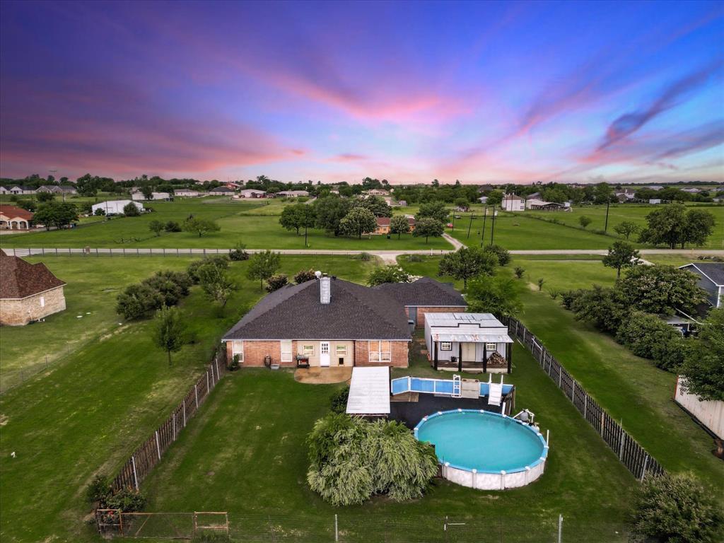 A RARE Slice of Texas Paradise on 2.25 Acres in Alvarado, outside the city limits and NO HOA in sought after Alvarado ISD!! USDA Eligible 

Welcome to your dream retreat in the country, just minutes from all the big city conveniences! This beautifully maintained 3 bedroom, 2 bath home with a bonus room, above ground pool with deck surrounding, a pool house with a bar and half bath, workshop plumbed for a bathroom, a pond and much more!!! Offering the perfect blend of comfort, space, and outdoor enjoyment.

Inside, you’ll love the open concept living, kitchen, and dining area with soaring 10 foot ceilings and a cozy wood burning fireplace, ideal for family gatherings or quiet nights in. The versatile bonus room features built in shelves, perfect for an office or study, and can be used as a 4th bedroom.

Function meets charm with an oversized laundry room and enormous pantry that lead to the spacious garage. Don’t miss the rare attic fan located in the pantry, a thoughtful and energy efficient feature!

Step outside to your enclosed back patio with dog doors for your furry friends, or dive into summer fun with the 24' above ground pool, complete with decking and a covered cabana. Back yard private fencing, pipe fence in the front. Entertain with ease in the detached 20x20 pool house featuring a full bar with sink, and half bathroom, perfect for guests or weekend get togethers. 

Need a place to work or store your toys? The 30x30 metal shop boasts a 6 inch slab, oversized electric panel, roll up door, and is plumbed for a future bathroom, ready for your workshop, studio, or additional garage space. As well as a 40 foot shipping Container for even more storage!!

Many upgrades have been made, see documents for the full list!

Don’t miss this rare opportunity to enjoy peaceful country living with all the amenities! Schedule your showing today and experience what makes this Alvarado gem so special!