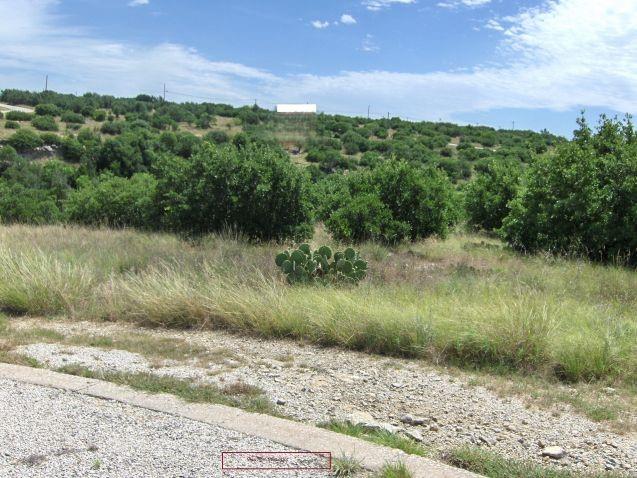 Welcome to The Cliffs at Possum Kingdom Lake gated community!  This beautiful, natural, greenbelt lot offers serene landscape and great potential to build the home of your dreams. Ownership includes access to the clubhouse, tennis court, marina, restaurant, 2 swimming pools, and golf.