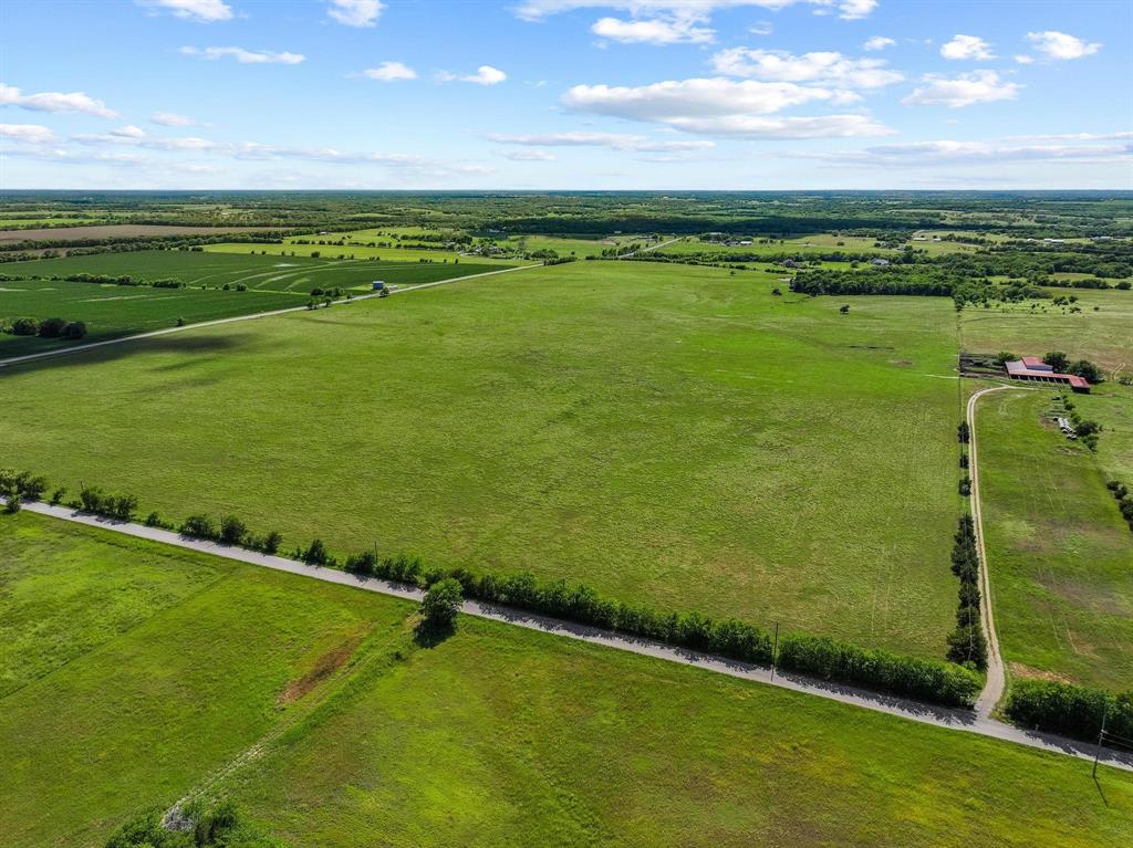 Property has been re-listed. Do not contact property owner. Rare opportunity to own 100+ acres in Grayson County! Welcome to your slice of Texas paradise—100+ sprawling acres offering the perfect blend of open pasture, mature hardwoods, and wide-open skies. Whether you’re looking to build your dream ranch, expand your agricultural operation, or invest in prime land with serious future potential, this property checks all the boxes. Located just 65 miles from Dallas, 30 miles to McKinney, and only 20 miles to Sherman, this property combines the serenity of the countryside with convenient access to major city amenities.
This would be a subdivided piece from the original 244+ acres, and would be the road frontage, pasture land. Highlights of the entire property include: Three stocked ponds, ideal for livestock or peaceful fishing afternoons. Large barn, ready for equipment, hay storage, or livestock shelter. Water and electricity already onsite—making building a homesite or agricultural use a breeze. Gently rolling pastures, perfect for grazing or hay production. Secluded wooded areas offering privacy, wildlife habitat, or trail opportunities.
Property offers access and frontage from three roads (FM-697, One Mile Lane, and Whitworth).
Currently used for farming and ranching with an ag exemption in place, this versatile acreage offers countless possibilities—whether you’re envisioning a working ranch, a weekend retreat, or a long-term investment with high growth potential.
Don’t miss this rare chance to own a large, utility-ready tract of land in one of North Texas’s most desirable and rapidly growing regions!
MUST have an appointment to see this property. Listing agent will be present for all showings. Current cattle lease in place, with cattle on site.