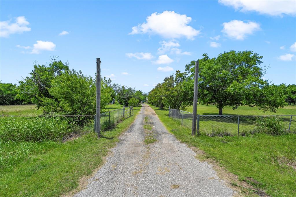 Do you have a vision for your own small farm with a large family friendly house?  THIS IS YOUR SIGN!  This truly is a hidden gem fixer upper brimming with untapped potential!! Lovely 12.75 acres in an extremely convenient location.  Close to Temple but with Moody ISD schools.  Whether seeking a weekend getaway or a permanent escape, this retreat promises serenity and an idyllic countryside lifestyle.  Wet weather creek on property.  12.75 acres that could accommodate several farm animals.  Fenced back yard for the pets.  Several fruit trees such as pecan and peach already thriving!  The house is roomy, 3300+ square feet,  with 3 bedrooms, 2 full baths, expansive, family friendly living and 2 dining areas.  Great mud laundry room with sink.  Dry bar area.  Front porch is enclosed for extra living space.  Large screened in back porch perfect for sitting and enjoying your morning coffee.  Master bedroom has an en suite bath with 2 vanity sinks, separate walk in shower and tub.  Large secondary bath.  An approximately 30 x 60 shop with electricity and water awaits a carpenters touch.  This is a golden opportunity to own your own piece of heaven.  This property is in USDA 100% eligibility zone.  Check with your lender!!  It's rectangular shape would lend itself to possible development.
