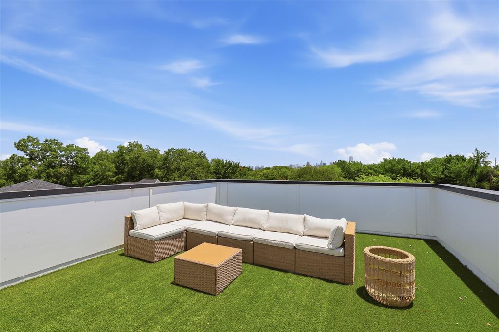 You can own this modern luxury minutes from Downtown Dallas with rooftop skyline views with ZERO DOWN PAYMENT and NO HOA. Experience elevated urban living in this striking Dallas contemporary home, perfectly positioned near Downtown Dallas, the Medical District, Uptown, Trinity Groves, the Design District, Love Field Airport, and major employment centers. Barely over a year old, this architecturally stunning multi-story residence blends modern design, natural light, and breathtaking 360-degree Dallas skyline views to create a rare indoor-outdoor living experience. The first floor features a private ensuite retreat with direct access to the backyard, ideal for guests, work, or a quiet escape. On the second level, open-concept living takes center stage with an expansive living area, dramatic electric fireplace, front-facing balcony, and designer kitchen with custom cabinetry, waterfall island, pantry, and sleek black stainless steel appliances. The third level offers a luxurious second primary-style suite with its own fireplace, built-in dry bar, walk-in closet, and spa-inspired bath, plus an additional ensuite bedroom for added comfort and flexibility. Crowning the home is a fourth-floor rooftop retreat with dual terraces and panoramic views of the Dallas skyline, perfect for morning coffee, sunset views, or nights under the city lights. Located near restaurants, art galleries, major highways, and downtown conveniences, this modern home near Downtown Dallas delivers the perfect blend of luxury, lifestyle, and location. Schedule your private showing today.