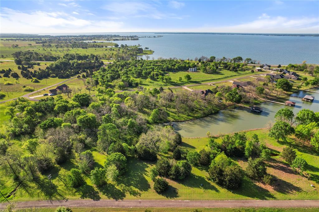 The lake is full and Lots 21, 22, & 23 in BayBridge is ready for you to build your dream home! Located just over an hour from Dallas on the stunning Richland Chambers Lake—the fifth-largest lake in Texas—this property offers access to over 40,000 acres of open water for endless lake days filled with boating, fishing, and relaxation. BayBridge is a gated community with a 2,000 sq. ft. minimum build requirement, but there’s no timeline to start construction—giving you the freedom to build at your own pace. Situated in a protected cove with over six feet of water depth just off the shoreline, this lot is ideal for swimming, fishing, or building your own private boat dock. Looking for more space? Don’t miss this incredible opportunity to create your perfect lakeside retreat on beautiful Richland Chambers!