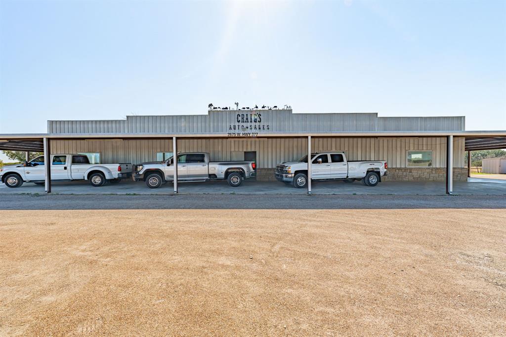 Fantastic Commercial Opportunity! Check this one out! Located at the Corner of US Hwy 377 and Loop 567 just on the west side of Granbury! This location has the visibility! It located just outside of the city limits! It is currently being used as an auto dealership but has so many more potential options! The property has its own water well and septic. The lot is laid out in a way where it provides so much road frontage and visibility! This place could continue on as an auto dealer, be a restaurant or so many other retail options! If you need a place in Granbury and want the very best exposure for your business,  look no further! This is the one! The opportunities this one presents are endless, so come take a look and see if it will work for you!