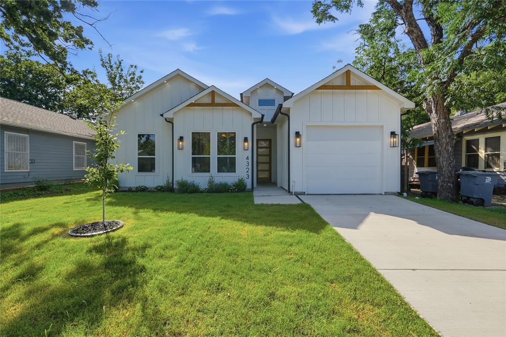 Experience modern living at its finest in this wonderful designed contemporary home, ideally located just minutes from Downtown Dallas & Fair Park, providing effortless access to everything the city has to offer. Thoughtfully built with high end finishes that are rarely found at this price point, this exceptional 3 bedroom, 2 bathroom residence offers the perfect blend of style, comfort, and functionality. The open concept floor plan is filled with natural light from oversized windows, complemented by designer lighting and a sleek electric fireplace that creates a warm and inviting living space. The kitchen features custom cabinetry, premium finishes, a built in microwave, and ample counter space, making it ideal for both everyday living and entertaining. The spacious primary suite serves as a private retreat with a spa like ensuite bathroom showcasing a luxurious walk in shower, freestanding soaking tub, dual vanities, and a custom walk in closet. Step outside to a generously sized, fully fenced backyard surrounded by mature trees, offering the perfect setting for outdoor gatherings, family activities, or simply relaxing in your own private oasis. Situated in one of Dallas fastest growing neighborhoods, this home combines modern elegance, quality craftsmanship, and an unbeatable location. Whether you're a first time homebuyer, growing family, or investor, this is an incredible opportunity to own a stunning home in a thriving area.