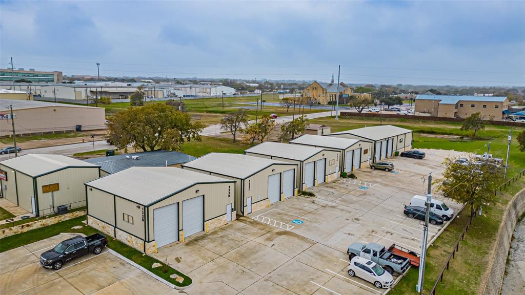Incredible opportunity to acquire a fully occupied office–warehouse FLEX property generating more than $150,000 in gross annual rental income. Strategically positioned just minutes from Lockheed Martin in White Settlement, with quick access to I-30 and Downtown Fort Worth, this location remains in constant demand—one of the many reasons it stays 100% leased and sits on over one and a half acres of land. 

The property features six office-warehouse FLEX buildings, each designed with functional layouts, private utility management for tenants, roll-up doors, and low-maintenance gravel parking and driveways. Tenants appreciate the prime location, the ease of doing business, and the flexibility to grow and expand within the community.

Most tenants are currently on month-to-month leases, giving a new owner the rare advantage of immediate value-add potential through rent adjustments or long-term lease restructuring. High-demand, low-vacancy industrial space in this area is difficult to find—making this a rare and exceptional investment opportunity. Current tenants include a auto mechanic, a personal trainer, a golf ball store, and a movie production company. All tenants pay well and on time.  

Property being managed by professional property management company that can continue with new owner.