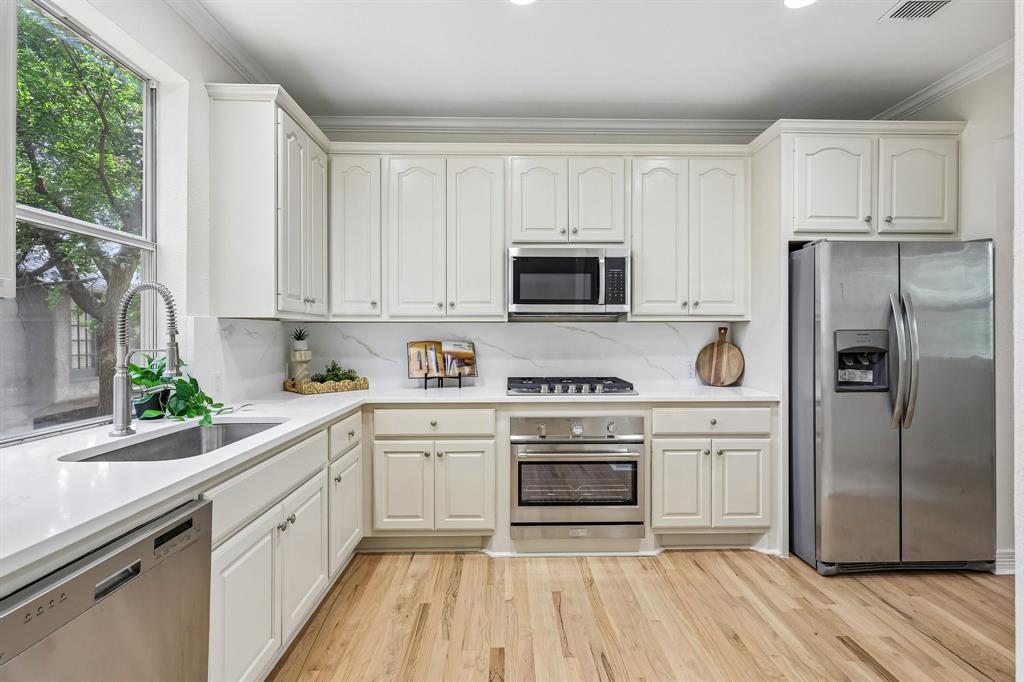 Beautifully enhanced townhouse, with no HOA, in the highly sought after Oak Lawn area.  Offering an exceptional blend of sophistication and convenience with over $100K in upgrades throughout. Designed with style and comfort in mind, this stunning residence features new flooring, elegant plantation shutters, and a thoughtfully renovated kitchen showcasing new countertops, updated appliances, and freshly painted cabinetry. The bathrooms have been tastefully modernized, and newly installed water heaters provide added peace of mind. Surrounded by mature trees, this home also offers rare outdoor living spaces including a spacious deck and private fenced yard. HALO-LED® Whole Home Air Purification System done in 2024.