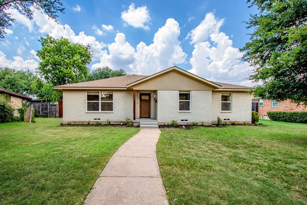 Welcome home to 6333 Symphony Lane in the established Buckner Terrace neighborhood of southeast Dallas, just off Interstate 30 with a quick drive into downtown. Big-ticket work is already done, including a new 30-year architectural shingle roof, new windows, new electrical, new plumbing, recessed lighting, ceiling fans, and new tile and carpet throughout.
Just inside the entry, a large dining room opens to your left. The home flows into the living room, anchored by an upgraded modern fireplace with custom built-in shelving. The kitchen is open to the living room and carries the same attention to detail, with custom soft-close cabinetry, quartz countertops, open shelving, and a large walk-in pantry lined with wrap-around shelving.
The first hallway off the living room leads to a private wing with three bedrooms and updated bathrooms. The hall bathroom features a new vanity, and one of the bedrooms has its own private bathroom, ideal as a guest suite or home office. Off the utility room is a second living space with a sink and shelving, perfect as a year-round sitting room, playroom, or hobby room.
The primary suite sits just past that second living area in its own private corner, with a walk-in closet and an updated bathroom with a roomy walk-in shower.
The backyard is a big part of what makes this one special. The whole lot has been cleared and cleaned up into a large, usable space with plenty of shade from the mature trees. New cedar privacy fencing runs around the entire yard, 10 feet tall across the back and 8 feet down both sides, so the whole space stays private even with everything close by.
There's a wide-open lawn, fresh flower beds, and a concrete sport court with a basketball goal. The detached two-car garage sits at the back of the lot with alley access, so it stays out of the way of the yard.
Extensively renovated, flexible layout, big private backyard come see it in person.