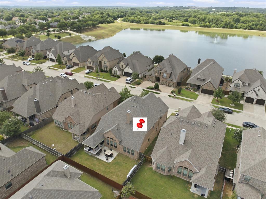 Welcome to 8401 Sandhill Crane, where luxury, peace of mind, and an unbeatable Mid-Cities location come together in the sought-after Lakes of River Trails West. Lovingly maintained by its original owners, this exceptional home features a new roof (May 2026), new HVAC system (October 2025), transferable warranties, a whole-home water purification system, and a Tesla Level 2 Wall Connector.
Ideally located between Dallas and Fort Worth, you'll enjoy convenient access to DFW Airport, major employers, premier shopping and dining, Trinity Railway Express, AT&T Stadium, Globe Life Field, Six Flags, and more. Situated in highly acclaimed HEB ISD, the community also offers scenic lakes, parks, greenbelts, and miles of walking and biking trails connecting to the Trinity Trails.
The chef-inspired kitchen features a premium gas cooktop, Bosch 800 Series 3-rack dishwasher, upgraded vent hood, oversized island, pot-and-pan drawers, a large walk-in pantry, and a butler's pantry with built-in wine and stemware storage.
The open-concept living room showcases soaring cathedral ceilings, a dramatic wall of windows with custom draperies, and abundant natural light. A flexible front room serves as a home office or formal dining room, while the media room and spacious game room provide excellent space for entertaining.
Storage is exceptional throughout, with walk-in closets in every bedroom. The oversized primary suite offers dual vanities, a soaking tub, separate shower with body jets, linen storage, and a large walk-in closet with direct access to the oversized laundry room.
Enjoy outdoor living on the spacious covered patio, perfect for dining, grilling, and relaxing. With extensive updates, luxury finishes, outstanding storage, award-winning schools, and an exceptional location, 8401 Sandhill Crane is truly move-in ready.