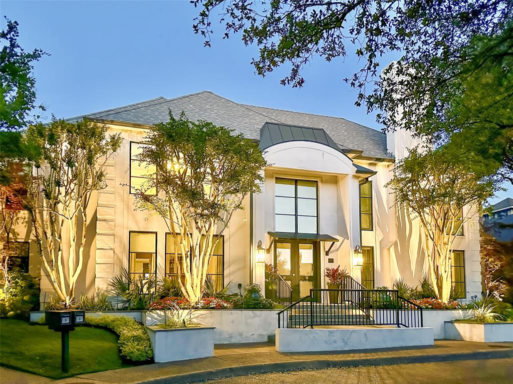 Act fast—this modern masterpiece won’t last long! Completely reimagined in 2020, this home features sleek mortared brick, new entry doors, and thermal pane low-E glass windows. Inside, soaring ceilings, gleaming hardwood floors, and expansive formals with a wet bar create an entertainer's dream. The chef's kitchen includes a Butler's Pantry, Scullery kitchen, and main kitchen equipped with Wolf, SubZero, and Asko appliances. The Primary Suite on the South wing boasts a sitting area, fireplace, walk-in closet, and coffee bar. The central outdoor living area features conservation grass, a dining space, and a gas grill. Upstairs, find a second Primary Suite, additional ensuite bedroom, study, and a media-game room with kitchenette—perfect for multi-generational living. This home, with its 2020 updates including a new roof, LED lighting, and EV-ready outlet, lives like new!