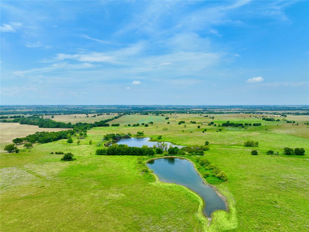 This exquisite 204-acre ranch is a slice of paradise nestled just 17 miles South of Fort Worth and NW of Cleburne city limits. From the gentle rolling hills to the level land, this property boasts stunning topography sure to take your breath away. The property features an impressive 3,569 feet of road frontage on two sides, providing easy access to this hidden gem. With a complete boundary fence and two fully stocked ponds, this ranch offers an abundance of opportunities, from fishing to livestock watering, and even serves as an enticing water source for wildlife seeking refuge in the area. Great proximity to DFW Metroplex, this ranch offers more than its natural beauty, it offers endless possibilities like an oppty to escape the city life. 
This peaceful oasis is a rare find, a valuable investment that will provide years of enjoyment and growth opportunities. Don't miss out on this exceptional chance to own your piece of Texas, come discover what makes this property so unique!