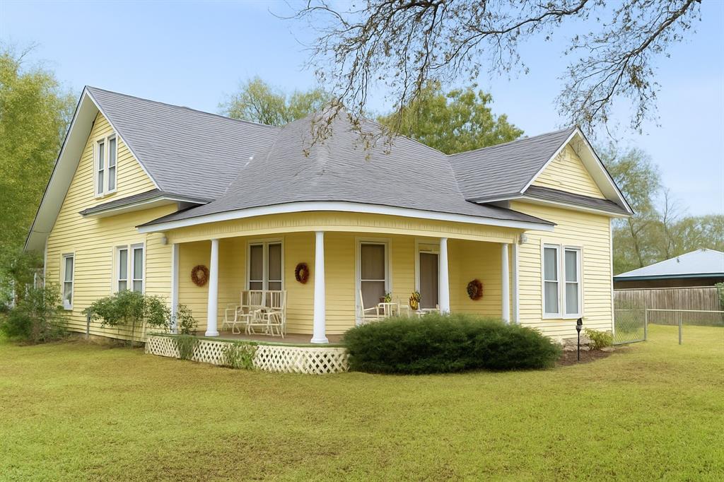 Huge Price Improvement! Discover refined historic charm in this beautifully maintained 1935 Folk Victorian home with subtle Queen Anne detailing. This 3-bedroom, 2-bath home offers a blend of character and comfort, featuring a picturesque front porch, tall windows, cozy back porch and striking front gables. Thoughtfully updated while preserving its architectural integrity, the home provides spacious living areas, warm natural light, and timeless craftsmanship throughout. Set on a tranquil corner lot just an hours commute from Dallas. This property delivers an exceptional opportunity to own a truly unique and gracefully restored Texas classic.