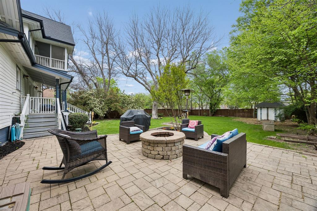 Step into a piece of McKinney history at 610 N Church—where timeless architecture, modern livability, and an unbeatable location come together in one unforgettable home. Originally built in 1895, this iconic residence sits on one of the most sought-after streets just moments from Historic Downtown McKinney Square—meaning coffee runs, dinner reservations, boutique shopping, and weekend events are all just a short walk or golf cart ride away.

From the moment you arrive, the charm is undeniable. A classic white picket fence frames the property, while the expansive front porch invites you to slow down and take in the storybook setting. Mature trees and lush landscaping create a sense of privacy and warmth.

Inside, the scale impresses with soaring ceilings, oversized rooms, and original architectural details blended with thoughtful updates. Rich hardwood floors, detailed trim work, and transom windows preserve the home’s character while enhancing everyday comfort. Multiple living and dining spaces provide flexibility for entertaining or quiet evenings, including a formal dining room and additional areas ideal for a library, music room, or lounge.

The kitchen features freshly painted cabinetry, ample counter space, and an open flow to the main living areas. Natural light pours in through oversized windows, creating a bright, airy feel. The primary suite offers a spacious retreat with an updated bathroom, soaking tub, and walk-in shower. Secondary bedrooms are generously sized, each with unique charm, and a screened-in upstairs patio adds a special touch.

Upstairs, additional flexible space and a bonus area are perfect for a game room, media space, or entertaining. Outside, the expansive backyard is private and shaded, complete with a large patio and fire pit.

Homes like this rarely come available. With rich history, impressive square footage, architectural charm, and walkability to Downtown McKinney, 610 N Church is more than a home—it’s a lifestyle.