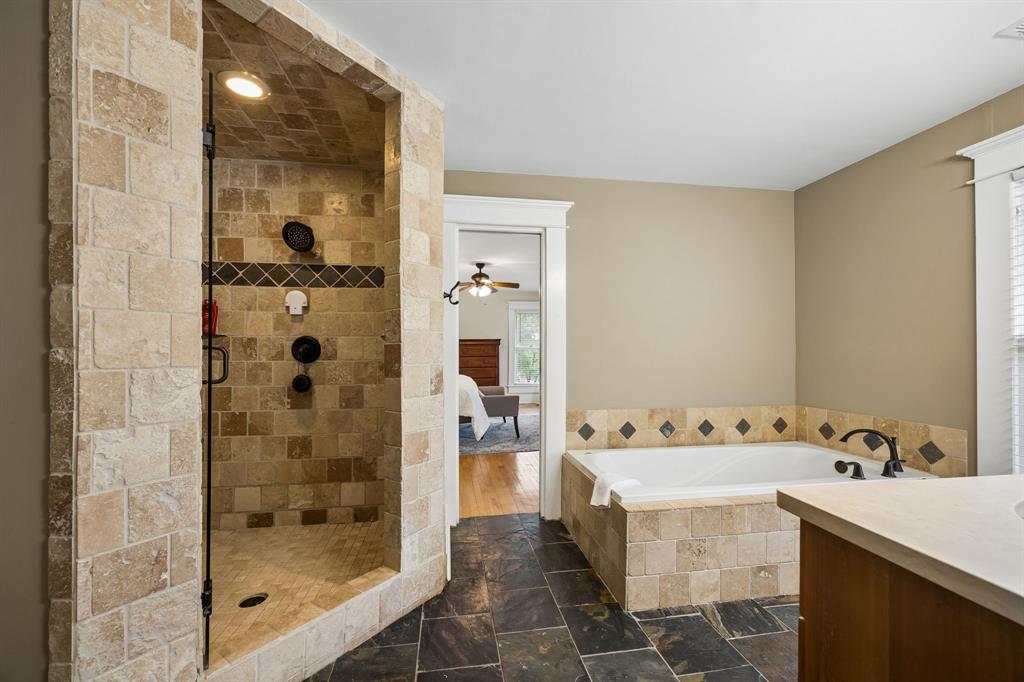 Step into a piece of McKinney history at 610 N Church—where timeless architecture, modern livability, and an unbeatable location come together in one unforgettable home. Originally built in 1895, this iconic residence sits on one of the most sought-after streets just moments from Historic Downtown McKinney Square—meaning coffee runs, dinner reservations, boutique shopping, and weekend events are all just a short walk or golf cart ride away.

From the moment you arrive, the charm is undeniable. A classic white picket fence frames the property, while the expansive front porch invites you to slow down and take in the storybook setting. Mature trees and lush landscaping create a sense of privacy and warmth.

Inside, the scale impresses with soaring ceilings, oversized rooms, and original architectural details blended with thoughtful updates. Rich hardwood floors, detailed trim work, and transom windows preserve the home’s character while enhancing everyday comfort. Multiple living and dining spaces provide flexibility for entertaining or quiet evenings, including a formal dining room and additional areas ideal for a library, music room, or lounge.

The kitchen features freshly painted cabinetry, ample counter space, and an open flow to the main living areas. Natural light pours in through oversized windows, creating a bright, airy feel. The primary suite offers a spacious retreat with an updated bathroom, soaking tub, and walk-in shower. Secondary bedrooms are generously sized, each with unique charm, and a screened-in upstairs patio adds a special touch.

Upstairs, additional flexible space and a bonus area are perfect for a game room, media space, or entertaining. Outside, the expansive backyard is private and shaded, complete with a large patio and fire pit.

Homes like this rarely come available. With rich history, impressive square footage, architectural charm, and walkability to Downtown McKinney, 610 N Church is more than a home—it’s a lifestyle.