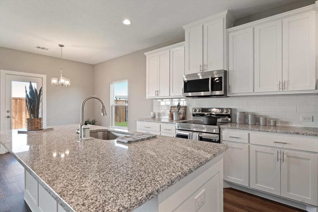 BUILDER INVENTORY CLEARANCE!! Don't miss out on this NEW CONSTRUCTION HOME!! This custom home has it all: 4 bedroom, 3.5 bathroom home includes a study and 2 Living Areas! The open concept kitchen includes upgraded stainless steel appliances and a large island with Granite countertops. Other features include custom cabinets, luxury vinyl plank floors, brushed nickel electrical and plumbing fixtures. The lot is landscaped and fully sodded with irrigation. Front & back porches offer a relaxed setting. Home has limited lifetime architectural shingles & spray foam insulation. Lovely property located on the outskirts of a small German town offering unique shopping, food and four nearby vineyards. Approximately 1 hour north of DFW Airport and 30 minutes to Winstar Casino! MUENSTER ISD is an award winning ISD!