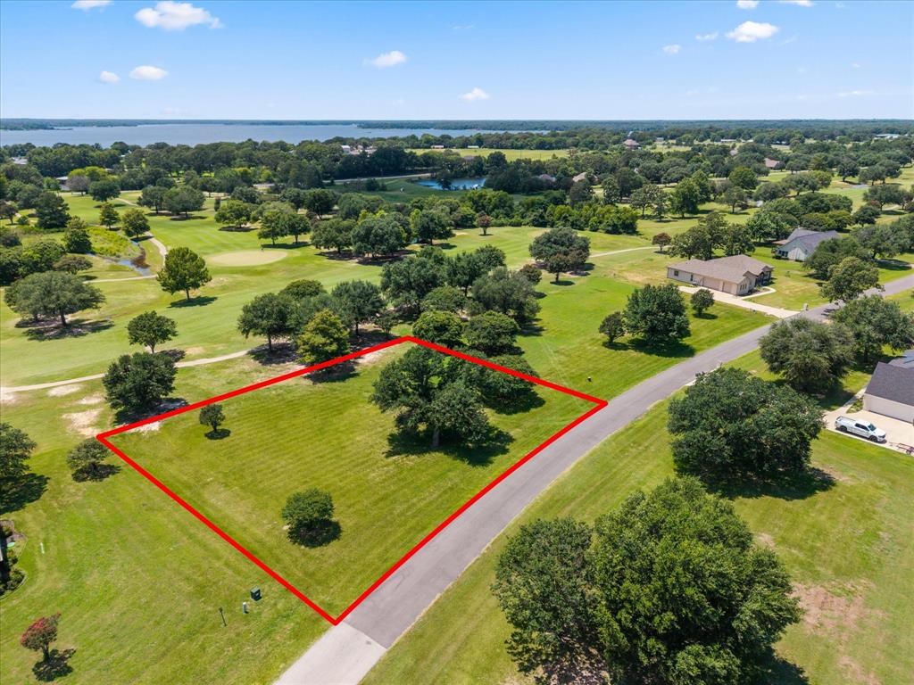 Build your dream home on this exceptional homesite overlooking the beautiful Lake Fork Golf Course! Enjoy the perfect blend of peaceful country living and resort-style amenities in this family-oriented community. The challenging 18-hole golf course features a full-service clubhouse, making it easy to spend the day golfing, dining, and relaxing close to home. Located on the west banks of the world-famous Lake Fork Reservoir, known as the Bass Capital of Texas, you’ll have incredible fishing and boating opportunities just minutes away. Conveniently situated only about an hour from the DFW Metroplex, this build-ready lot offers the ideal escape for a weekend retreat or your forever home. Don’t miss this opportunity to own property in one of East Texas’ premier golf and lake communities. Lot 16 that sits next to this one for sale also.