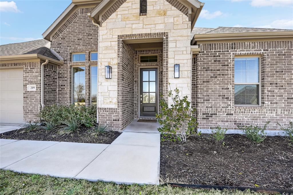 Enjoy the space of country living with the comfort of newer construction at 209 Basalt Ln in Azle. Built in 2023, this beautifully designed 4-bedroom, 2-bath home offers 2,181 square feet of well-planned living space plus a dedicated office, all situated on just over an acre.

Inside, the open-concept floor plan creates a natural flow between the kitchen, dining, and living areas, making the home feel bright, spacious, and perfect for everyday living or entertaining. The kitchen features abundant cabinetry, generous counter space, and a layout that keeps you connected to the heart of the home.

The private primary suite offers a relaxing retreat with an ensuite bath and walk-in closet, while the split-bedroom design provides privacy for the secondary bedrooms. The dedicated office adds flexibility for working from home, studying, or creating a quiet flex space.

Step outside and enjoy the possibilities that come with approximately 1.06 acres—plenty of room to relax, entertain, garden, or create your ideal outdoor setup. Located in Azle with convenient access to nearby shopping, dining, and commuting routes, this home offers the perfect blend of peaceful surroundings and modern living.