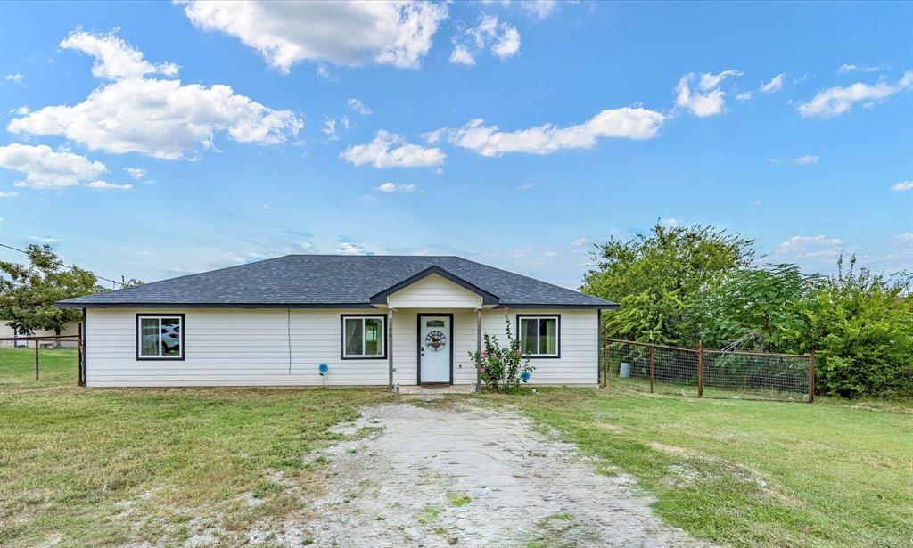 Welcome to this charming three-bedroom, two-bathroom home nestled on nearly half an acre in Bowie, Texas. Step inside to find LVP flooring throughout, creating a cohesive and easy-to-maintain space. The kitchen offers generous counter space and plenty of cabinetry for all your cooking and storage needs. The open dining and living area flow together beautifully, making it the perfect spot for hosting family and friends. The primary suite features a spacious walk-in closet and an en-suite bathroom with dual sinks. On the opposite side of the home, you’ll find two additional bedrooms with a shared full bath, offering privacy and comfort for guests or family. The laundry room provides space for a full-size washer and dryer and room for an extra refrigerator or freezer — perfect for added convenience. Outside, enjoy a fenced backyard with durable pipe fencing and plenty of room to make it your own. Whether you dream of adding a pool, creating a cozy fire pit area, or planting a garden, the possibilities are endless. A storage shed stays with the property, offering extra space for tools or outdoor equipment. Come see what this cozy home has to offer — and bring your vision for what it could be for you. Schedule your showing today!