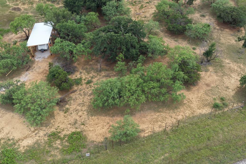 Commercial OR Residential! Just over ONE ACRE on I-20 with service road frontage. New parcel surveyed and separated from lumber company acreage, this property is ready for your business or residential build! PROPERTY UPDATED IN 2026 WITH WATER, ELECTRIC AND SEPTIC. RV COVER ALSO ADDED WITH HOOKUPS. RV COULD CONVEY WITH RIGHT OFFER. The community of Gordon and this stretch of Interstate located between Weatherford and Abilene is the next OPPORTUNITY ZONE headed out West of the DFW Metroplex and the thriving North Texas corridor. Property includes co-op water meter. Property does not include tank.